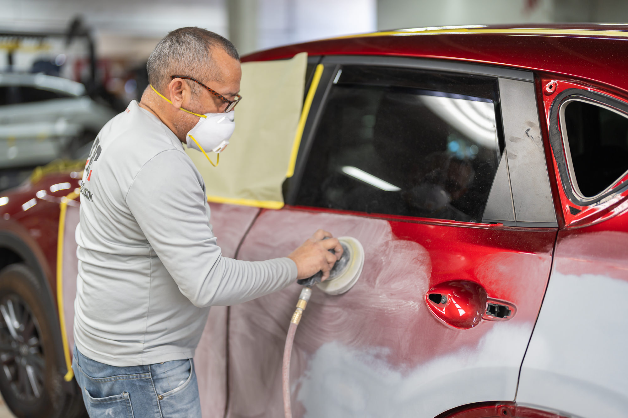 Quality control inspection and final buffing of vehicle